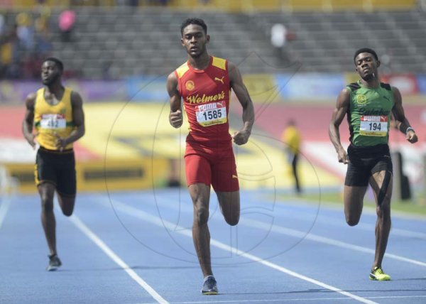 Shorn Hector/Photographer Jeremy Farr of Wolmer's  (center) wins heat two of the boys class one 400 meter semi-final ahead of calabar's Christopher Taylor on day four of the ISSA/GraceKennedy Boys and Girls’ Athletics Championships held at the The National Stadium in Kingston on Friday March 29, 2019