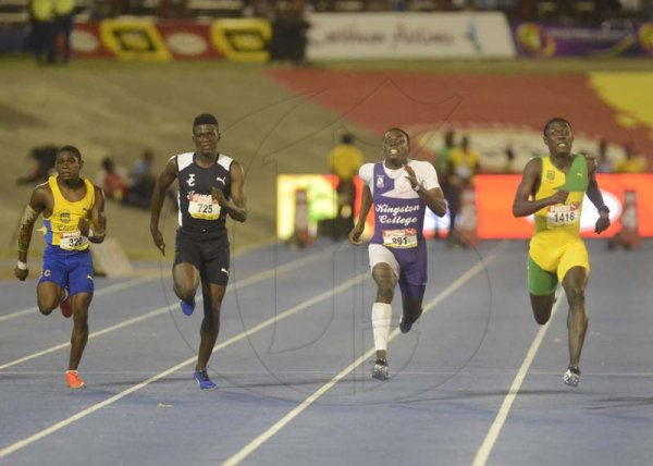Shorn Hector/Photographer Vashaun Vascianna of St Jago (right) wins the boys class 20 100 meter dash on ay four of the ISSA/GraceKennedy Boys and Girls’ Athletics Championships held at the The National Stadium in Kingston on Friday March 29, 2019