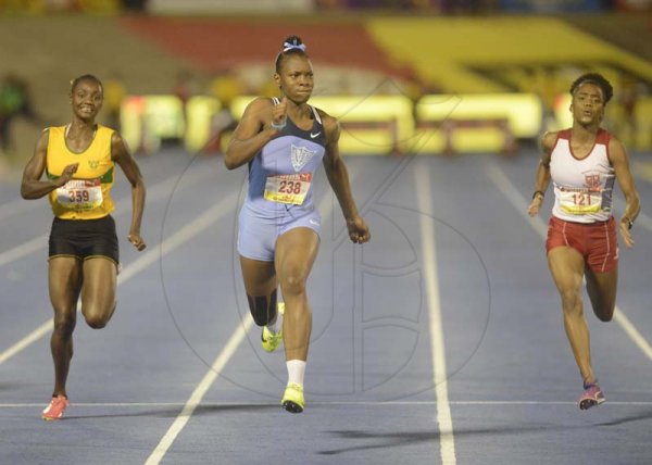 Shorn Hector/Photographer Kevona Davis (center) wins girls class two 100 mete final on day four of the ISSA/GraceKennedy Boys and Girls’ Athletics Championships held at the The National Stadium in Kingston on Friday March 29, 2019