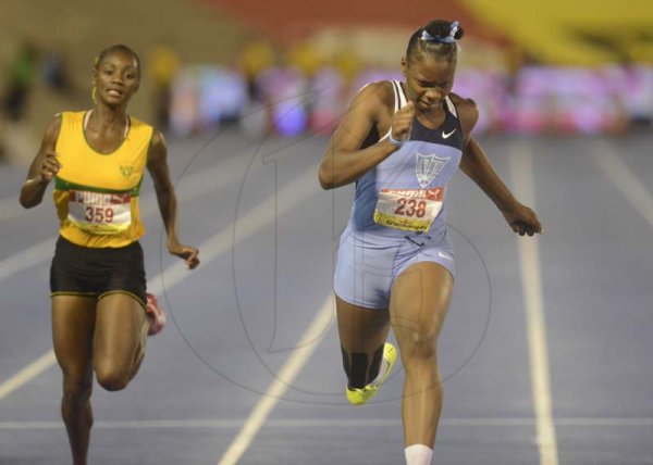 Shorn Hector/Photographer Kevona Davis (right) wins girls class two 100 mete final on day four of the ISSA/GraceKennedy Boys and Girls’ Athletics Championships held at the The National Stadium in Kingston on Friday March 29, 2019