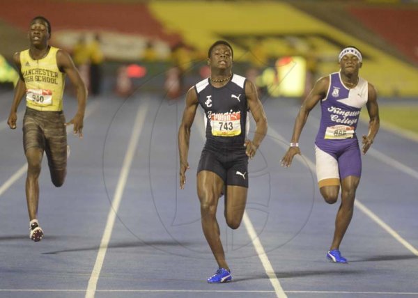Shorn Hector/Photographe Christopher Scott (center)  of Jamaica College wins the boys class three 100 meter finals on day four of the ISSA/GraceKennedy Boys and Girls’ Athletics Championships held at the The National Stadium in Kingston on Friday March 29, 2019