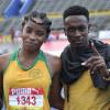 Shorn Hector/Photographer Chantal Gayle of Vere Technical shares a photo with coach Elon Murdock after winning the final of the girls class three High Jump on day three of the ISSA/GraceKennedy Boys and Girls’ Athletics Championships held at the The National Stadium in Kingston on Thursday March 28, 2019