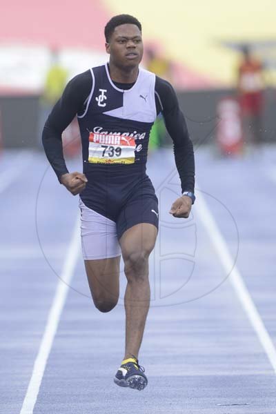 Shorn Hector/Photographer Ryiem Robertson of St Jamaica College wins heat one of the boys class one 100 meter dash on day three of the ISSA/GraceKennedy Boys and Girls’ Athletics Championships held at the The National Stadium in Kingston on Thursday March 28, 2019