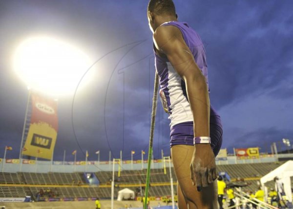 Shorn Hector/Photographer Chadrick Williams of Kingston College asses his run-up before making the winning jump of 3.70 meters in the boys decathlon Pole Vault clearing a height of 3.70 meters on day three of the ISSA/GraceKennedy Boys and Girls’ Athletics Championships held at the The National Stadium in Kingston on Thursday March 28, 2019