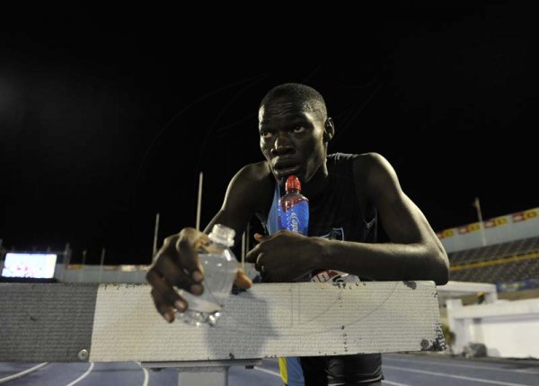 Shorn Hector/Photographer Javian McKellop of Tacious Golding looks on as he catches his breath after completing the boys steeple chase on day three of the ISSA/GraceKennedy Boys and Girls’ Athletics Championships held at the The National Stadium in Kingston on Thursday March 28, 2019