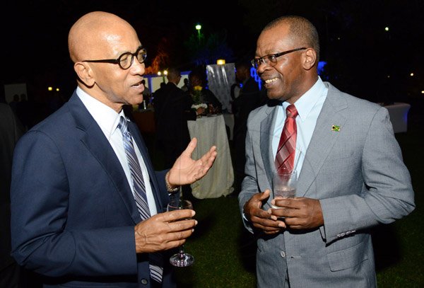 Rudolph Brown/ Photographer
Business Desk
Milverton Reynolds, (left) managing director Develoment Bank of Jamaica chat with Livingstone Morrison, deputy governor administration and technical services finance/ technolgy and payment system and risk management disvisions BOJ at the Development Bank of Jamaica's Venture Capital official Opening and Cocktail Reception at the Jamaica Pegasus on Monday, March 7, 2016