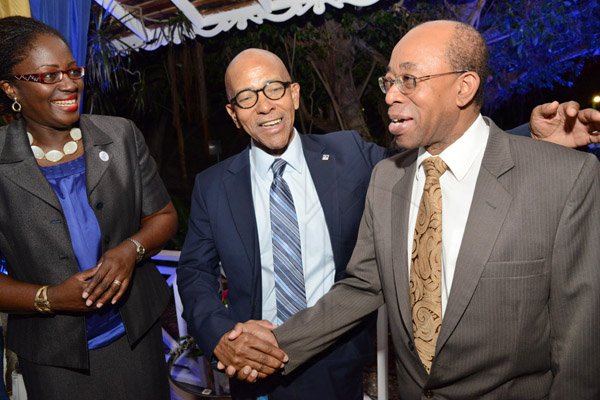 Rudolph Brown/ Photographer
Business Desk
Milverton Reynolds, managing director Develoment Bank of Jamaica greets Dr. Wesley Hughes, (right) Chief Executive Officer, Petro Caribe Fund and Nadienne Nieta, Director, Alternative Channels Columbus Business Solutions and at the Development Bank of Jamaica's Venture Capital official Opening and Cocktail Reception at the Jamaica Pegasus on Monday, March 7, 2016