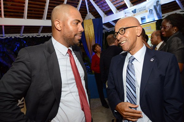 Rudolph Brown/ Photographer
Business Desk
Milverton Reynolds, (right) managing director Develoment Bank of Jamaica chat with Steven Whittingham, President, First Global Financial Services at the Development Bank of Jamaica's Venture Capital official Opening and Cocktail Reception at the Jamaica Pegasus on Monday, March 7, 2016