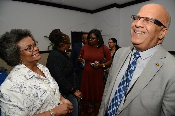 Rudolph Brown/ Photographer
Business Desk
Robert Stephens chat with Joanne Simpson of PetroCarbe Development Fund Research Officer at the Development Bank of Jamaica's Venture Capital Conference Pre-Conference Workshop at the Jamaica Pegasus on Monday, March 7, 2016