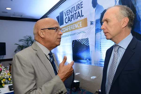 Rudolph Brown/ Photographer
Business Desk
Robert Stephens, (left) chat with Adam Nicolopoulos, Managing Director of ADN Capital Venture at the Development Bank of Jamaica's Venture Capital Conference Pre-Conference Workshop at the Jamaica Pegasus on Monday, March 7, 2016