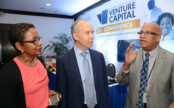 Rudolph Brown/ Photographer
Business Desk
Audrey Richards project coordinator Jamaica Venture Capital Programme, chat with Robert Stephens, (right) and Adam Nicolopoulos, (centre) Managing Director of ADN Capital Venture at the Development Bank of Jamaica's Venture Capital Conference Pre-Conference Workshop at the Jamaica Pegasus on Monday, March 7, 2016