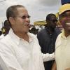 Leon Mitchell (right), Assistant General Manager, Marketing, and Promotions JNBS, greets Prime Minister the Honourable Bruce Golding as he embarks on a tour of the JN House at the 2010 Denbigh Agricultural and Industrial Show on Monday, August 2, 2010.