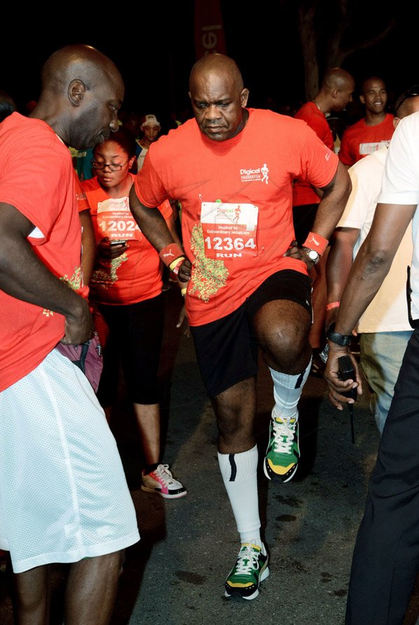 Winston Sill/Freelance Photographer
Digicel Foundation 5K Run/Walk for Special Needs, held on the Waterfront, Downtown Kingston on Saturday night  October 11, 2014. Here is Senate President Floyd Morris.