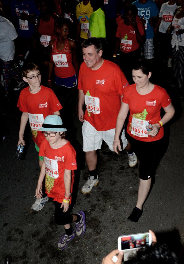 Winston Sill/Freelance Photographer
Digicel Foundation 5K Run/Walk for Special Needs, held on the Waterfront, Downtown Kingston on Saturday night  October 11, 2014. Here is Digicel CEO,  Barry O'Obrien (second right), and  his family, wife Ruth (right); son Luke (left); and daughter Christine (front).