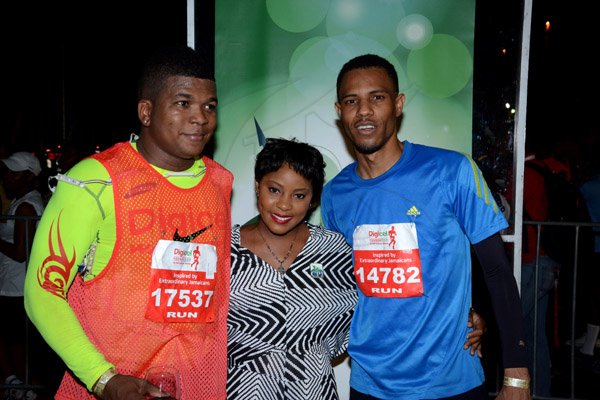 Winston Sill/Freelance Photographer
Digicel Foundation 5K Run/Walk for Special Needs, held on the Waterfront, Downtown Kingston on Saturday night  October 11, 2014. Here are Benjamin Simms (left), of Digicel; Karesha Allen (centre), CPJ Wines Brand Associate; and Aston Aiken (right).
