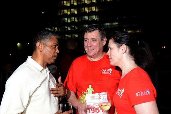 Winston Sill/Freelance Photographer
Digicel Foundation 5K Run/Walk for Special Needs, held on the Waterfront, Downtown Kingston on Saturday night  October 11, 2014. Here are Michael Stern?? (left); Barry O'Brien (centre), CEO, Digicel; and Ruth O'Brien (right).