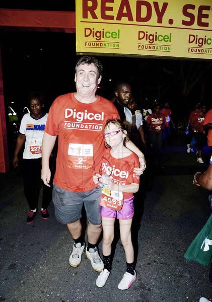 Winston Sill/Freelance Photographer
Digicel Foundation 5K Night Run/Walk and Concert, held on Ocean Boulevard, Downtown on Saturday night October 26, 2013. Here are Barry O'Brien CEO, Digicel  and daughter Christine.