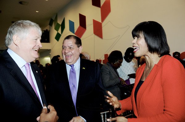 Winston Sill / Freelance Photographer
The Official Opening of Digicel Regional Headquarters by Prime Minister Portia Simpson-Miller, held at Ocean Boulevard on Tuesday March 19, 2013. Here are Denis O'Brien (left), Chairman, Digicel Group; Audley Shaw Centre); and Prime Minister Simpson-Miller (right).