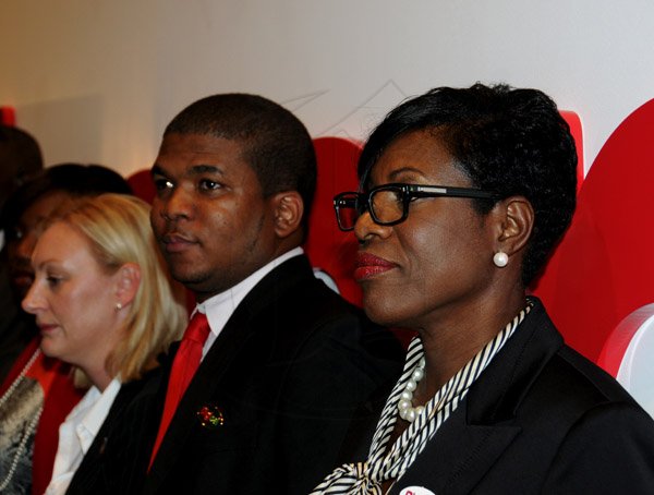 Winston Sill / Freelance Photographer
The Official Opening of Digicel Regional Headquarters by Prime Minister Portia Simpson-Miller, held at Ocean Boulevard on Tuesday March 19, 2013. Here are Antonia Graham (left), Head of Public Relations, Digicel Group; Benjamin Simms (centre); and Debbie Williams (right), Head Receptionist, Digicel Group.