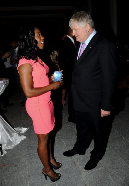 Winston Sill / Freelance Photographer
The Official Opening of Digicel Regional Headquarters by Prime Minister Portia Simpson-Miller, held at Ocean Boulevard on Tuesday March 19, 2013. Here are Shelly-An Fraser-Pryce (left); and Denis O'Brien (right), Chairman, Digicel Group.
