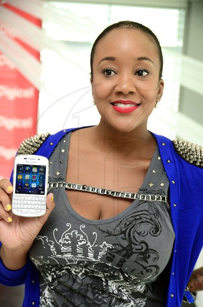 Gladstone Taylor / Photographer
Digicel brand ambassador Tifa, show off the Blackberry q10 for all Blackberry lovers with its trusty querty keyboard.


............................................................................
Tifa

Digicel launches the Blackberry Q10 at their ocean boulevard head office yesterday afternoon