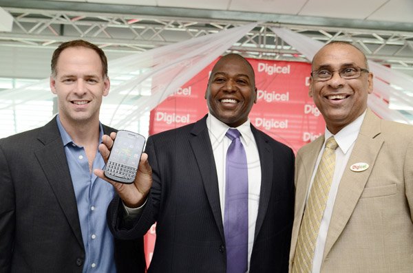 Gladstone Taylor / Photographer
From left: Sean Killen director- Caribbean Blackberry, Richard Burey manager Territory Channels, Blackberry) and Patrick King distributions director, Digicel, shows off the Blackberry Q10 at the launch at its Regional headquarters in downtown Kingston yesterday.
......................................................................
l-r Sean Killen (Director-Carribbean, Blackberry) , Richard Burey (Manager Territory Channels, Blackberry) and Patrick King (Distributions Director, Digicel)


Digicel launches the Blackberry Q10 at their ocean boulevard head office yesterday afternoon