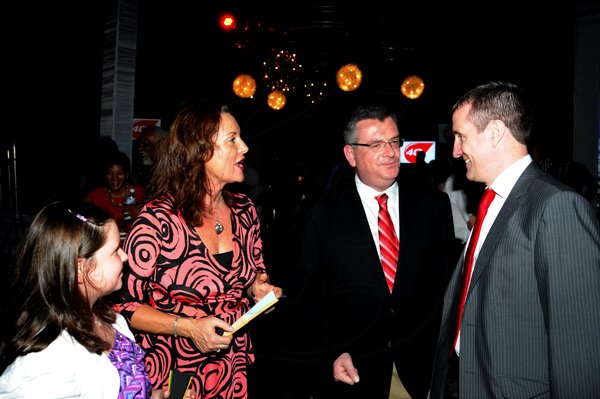 Winston Sill / Freelance Photographer
Digicel launch 4G Service. held at Victoria Pier, Ocean Boulevard on Monday night June 25,. 2012. Here are Hannah Delves (left); Paula Delves (second left); Colm Delves (second right), CEO, Digicel Group; and Mark Linehan (right), CEO, Digicel Jamaica.