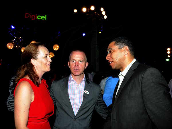 Winston Sill / Freelance Photographer
Digicel launch 4G Service. held at Victoria Pier, Ocean Boulevard on Monday night June 25,. 2012. Here are Fiona Looney (left); Conor Looney (centre), Marketing Director, Digicel; and Andrew Holness (right).