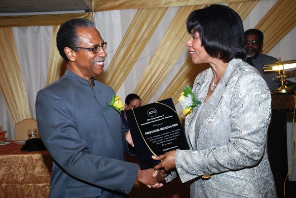 Colin Hamilton/Freelance Photographer
The Association of Consultant Physitians of Jamaica held it's 10th Annual President's Dinner in celebration of Jamaica's 50th Anniversary of Independence at the Terra Nova All Suites Hotel on Saturday September 8, 2012.

Prof. Brendan Bain receives his award from the PM.
