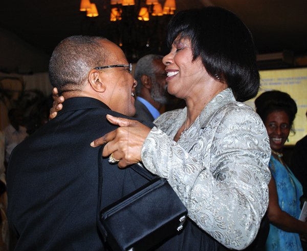 Colin Hamilton/Freelance Photographer
The Association of Consultant Physitians of Jamaica held it's 10th Annual President's Dinner in celebration of Jamaica's 50th Anniversary of Independence at the Terra Nova All Suites Hotel on Saturday September 8, 2012.

The PM gives Dr. Michael Abrahams a big hug.