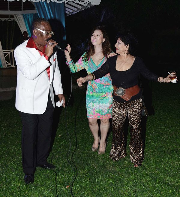 Winston Sill/Freelance Photographer
Dancing to the lyrics of reggae icon Ken Boothe (left) are  Sayoko Takase (centre), wife of the Japanese Ambassador; and Clelia Barreto De Hunter (right), Consul of Ecuador.