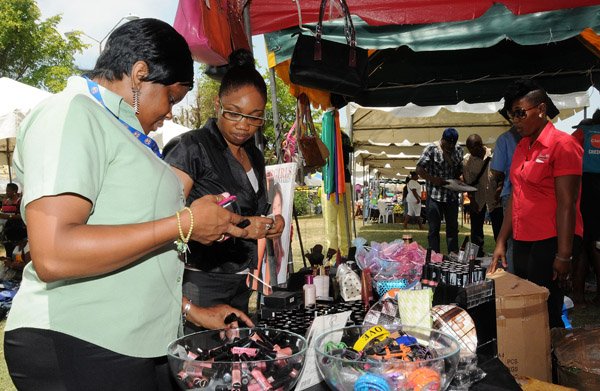 Gladstone Taylor / Photographer

Keron Campbell (left) and Diandra Smith shopping at the soho fashion tent

downtown sizzling summer savings at st williams grant park yesterday