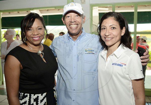 Rudolph Brown/Photographer
First Global Head of Marketing Peter Lindo pose with Maureen Hayden-Cater,(left) President First Global Bank and Diane Corrie at the Duke of Edinburgh Golf Tournament at Caymanas Golf Club on Sunday, March 2, 2014