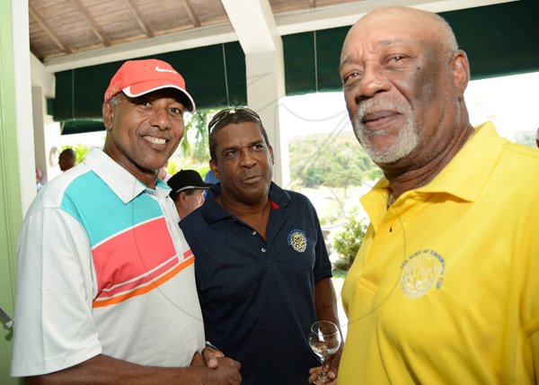 Rudolph Brown/Photographer
Paul Slaton (centre) greets Maurice Foster, (right) and Carlyle Hudson  at the Duke of Edinburgh Golf Tournament at Caymanas Golf Club on Sunday, March 2, 2014