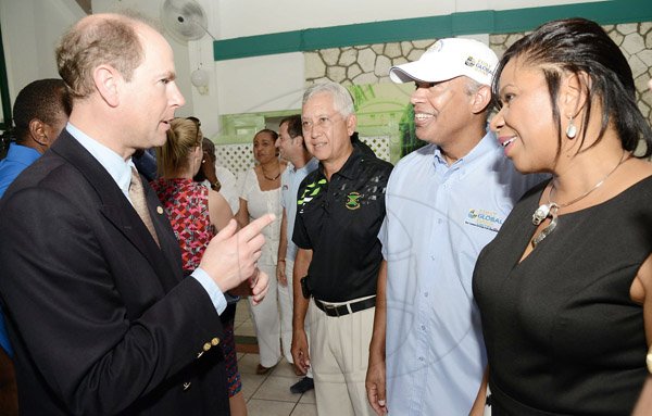 Rudolph Brown/Photographer
His Royal Highness Prince Edward, The Earl of Wessex the Duke of Edinburgh in discussion with First Global Head of Marketing Peter Lindo, (second right), Maureen Hayden-Cater, President First Global Bank and Wayne Chai Chong, (second left) president of the Jamaica Golf Association at the Duke of Edinburgh Golf Tournament at Caymanas Golf Club on Sunday, March 2, 2014