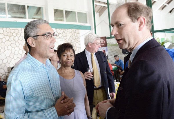 Rudolph Brown/Photographer
His Royal Highness Prince Edward, (right) The Earl of Wessex the Duke of Edinburgh in discussion with Richard Byles, President and CEO of Sagicor Life Jamaica and wife Jascinth at the Duke of Edinburgh Golf Tournament at Caymanas Golf Club on Sunday, March 2, 2014