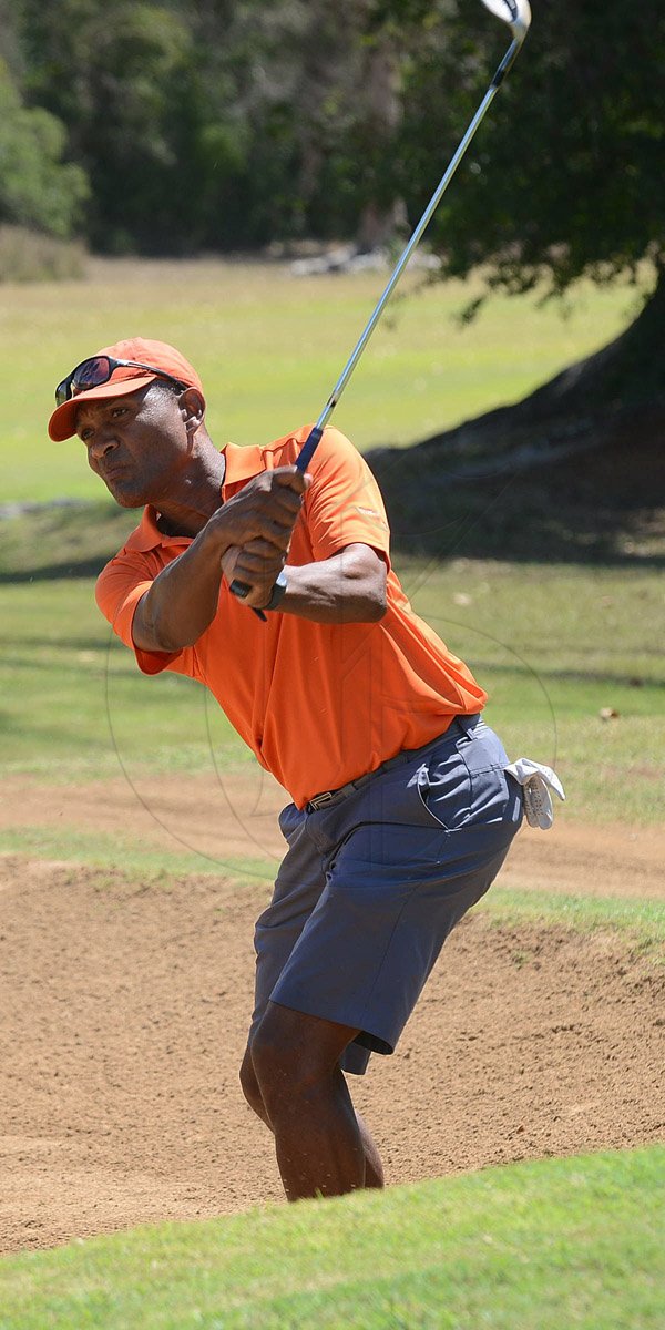 Rudolph Brown/Photographer
Radcliff Knibbs play at the Duke of Edinburgh Golf Tournament at Caymanas Golf Club on Sunday, March 2, 2014