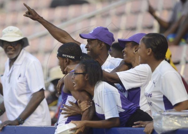 Shorn Hector/Photographer Wayne Pinnock celebrates with Kingston College fans after breaking the boys class one long jump record on day two of the ISSA/GraceKennedy Boys and Girls’ Athletics Championships held at the The National Stadium in Kingston on Wednesday March 27, 2019