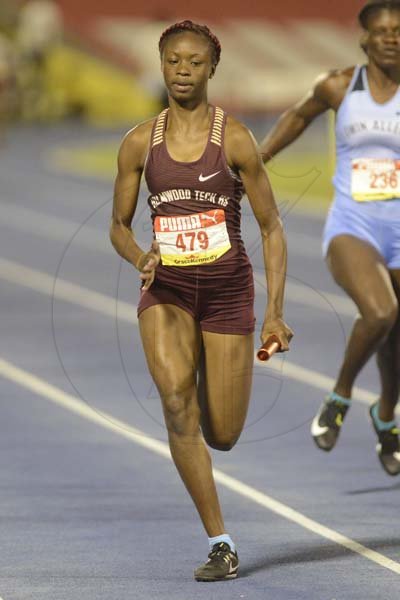 Shorn Hector/Photographer Kishawna Wallis of Holmwood Technical anchors her team to victory in heat 2 of the girls class one 4x100 merters relay on day two of the ISSA/GraceKennedy Boys and Girls’ Athletics Championships held at the The National Stadium in Kingston on Wednesday March 27, 2019