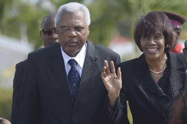 Shorn Hector/Photographer The Most Hon. Portia Simpson-Miller, former Prime Minister of Jamaica, accompanied by her husband Errol Miller arrives at the National Heroes Circle for the burial ceremony of the late Edward Seaga, former Prime Minister of Jamaica, on Sunday June 23, 2019