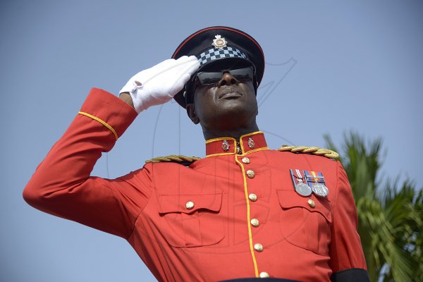Shorn Hector/Photographer A member of theJamaica Defence Force salutes during the burial ceremony of the late Edward Seaga, former Prime Minister of Jamaica, on Sunday June 23, 2019