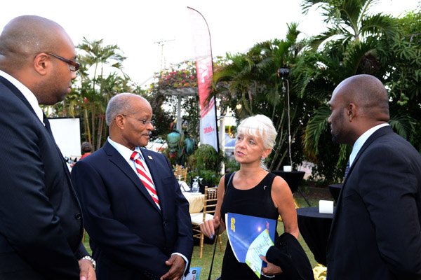 Winston Sill/Freelance Photographer
Environmental Health Foundation (EHF) 10th Annual Wellness and Lifestyle Awards Ceremony, held at Eden Gardens, Lady Muisgrave Road on Wednesday night April 30, 2014. Herte are Delano Seiveright (left); Sir Kenneth Hall (second left); Kelly Tomblin (second right); and Andrew Wheatley (right).