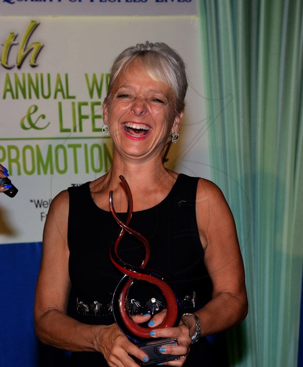 Winston Sill/Freelance Photographer
Environmental Health Foundation (EHF) 10th Annual Wellness and Lifestyle Awards Ceremony, held at Eden Gardens, Lady Muisgrave Road on Wednesday night April 30, 2014. Here is Kelly Tomblin, CEO, JPS pose with the EHF Ambassador Award.
