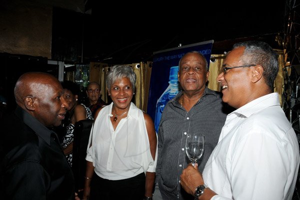 Winston Sill/Freelance Photographer
Offical opening of Everblazing Boutique, Bar and Lounge, held at Villa Ronai, Old Stony Hill Road on Tuesday night September 10, 2013. Here are Gurney Beckford (left); Sharon Barrett (second left); Rae Barrett (second right); and Robert Huaghton (right).