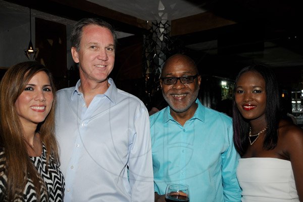 Winston Sill/Freelance Photographer
Offical opening of Everblazing Boutique, Bar and Lounge, held at Villa Ronai, Old Stony Hill Road on Tuesday night September 10, 2013. Here are Janin Barloza Cooper (left); Robert Cooper (second left), Managing Director, J. Wray and Nephew; Kingsley Cooper (second right); and Safia Cooper (right).