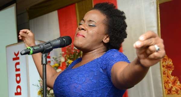 Rudolph Brown/Photographer
Etana sings at the Scotiabank Group Celebrating Excellence Service and Support awards ceremony at Knutsford Court Hotel in Kingston on Saturday, May 18, 2013