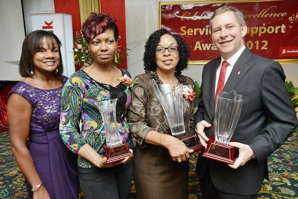 Rudolph Brown/Photographer
Bruce Bowen, President and CEO, Scotiabank and Rosemarie Voordouw, (left) director of employee consultations pose with Top Service and Support (Branch) Taniesha Coach, (second left) and Doreen Martimer, Negril branch manager at the Scotiabank Group Celebrating Excellence Service and Support awards ceremony at Knutsford Court Hotel in Kingston on Saturday, May 18, 2013