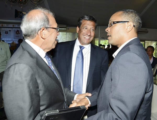 Rudolph Brown/Photographer
Robert Levy, (left) Chairman of Jamaica Broilers Group and Christopher Levy, President and CEO chat with Christopher Barnes, (right) Managing Director of The Gleaner at the 12th Anniversary Awards Luncheon for presentation of the 2011/2012 Fair Play Awards at the Terra Nova Hotel on Tuesday, September 11-2012