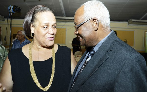 Rudolph Brown/Photographer
Wyvolyn Gager, (left) chat with Lester Spaulding at the 12th Anniversary Awards Luncheon for presentation of the 2011/2012 Fair Play Awards at the Terra Nova Hotel on Tuesday, September 11-2012