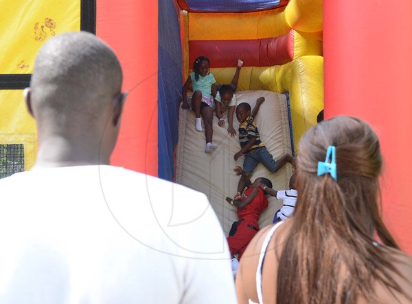 Ian Allen/Photographer
Children enjoy themselves in rides at the Lasco Family Extravaganza which was held at Hope Gardens on Boxing Day 2015.